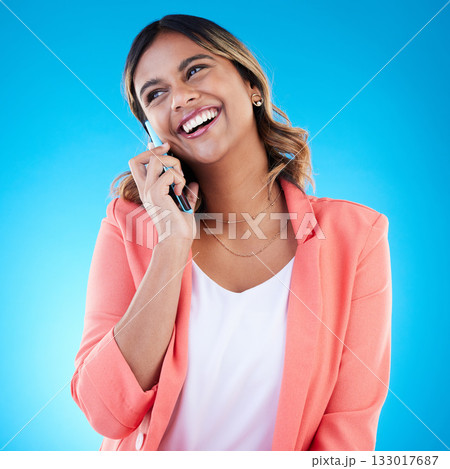Phone call, talking and smile of business woman in conversation, chatting or communication in studio isolated on blue background. Cellphone, thinking or happy Indian female professional in discussion 133017687
