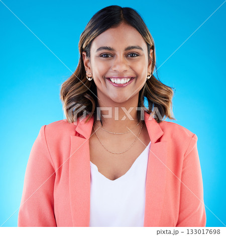 Smile, portrait and business woman in studio isolated on a blue background with pride for career, profession or job. Face, professional and confident, happy and proud female entrepreneur from India. 133017698