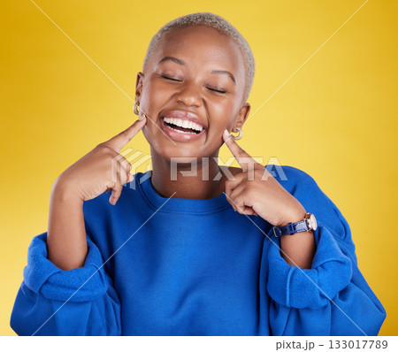 Fashion, smile and black woman happy pointing at her face excited and confident isolated in a studio yellow background. Style, happiness and young female with a positive mindset and confidence 133017789