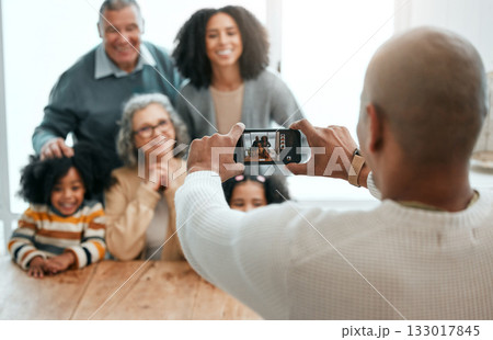 Love, smile or phone photography with happy family in living room for social media, bonding or relaxing. Happiness, pictures or generations with grandparents or children at home for memory or support Love, smile or phone photography with happy family in living room for social media, bonding or relaxing. Happiness, pictures or generations with grandparents or children at home for memory or support 133017845