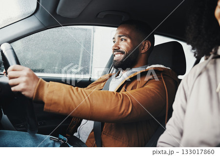 Man driving, rain and smile in city with car journey, winter travel and happiness for road trip. Guy driver, transportation and urban adventure with safety, vacation or holiday with excited face 133017860