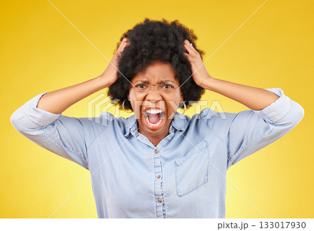 Crazy, face portrait and black woman scream, shout and yell from mental health crisis, angry rage or anger management problem. Afro, studio headshot and African person isolated on yellow background Crazy, face portrait and black woman scream, shout and yell from mental health crisis, angry rage or anger management problem. Afro, studio headshot and African person isolated on yellow background 133017930