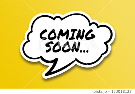 Comic speech bubble with Coming Soon text on yellow background 133018122