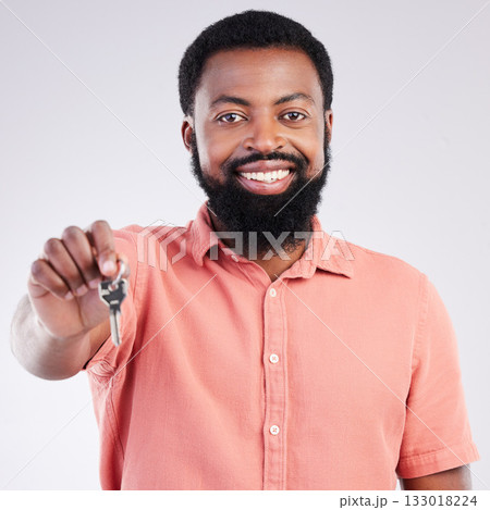Real estate, happy and portrait of a black man with keys isolated on a white background in a studio. Smile, pride and African guy showing a key to a new home, house or apartment as a property owner Real estate, happy and portrait of a black man with keys isolated on a white background in a studio. Smile, pride and African guy showing a key to a new home, house or apartment as a property owner 133018224