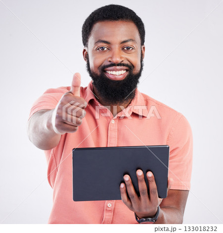 Thumbs up portrait, tablet or happy black man with emoji gesture for congratulations, job well done or winner. Agreement, finance results or studio person with yes sign for success on grey background Thumbs up portrait, tablet or happy black man with emoji gesture for congratulations, job well done or winner. Agreement, finance results or studio person with yes sign for success on grey background 133018232