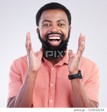 Happy, surprise and portrait of black man in studio for shocked, announcement and accomplishment. Smile, winner and achievement with male on gray background for celebration, omg and good news 133018234