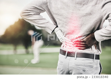 Sports, injury and golf, black man with back pain during game on course, massage and relief in health and wellness. Green, hands on spine for support and golfer with body ache during golfing workout. 133018340