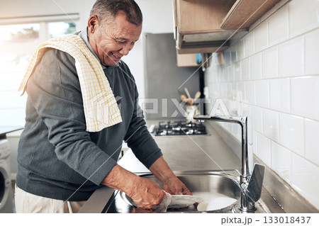 Cleaning, washing dishes or happy old man with soap and water in the kitchen sink in healthy home. Dirty, messy or senior person with liquid foam to disinfect, protect and prevent bacteria or germs Cleaning, washing dishes or happy old man with soap and water in the kitchen sink in healthy home. Dirty, messy or senior person with liquid foam to disinfect, protect and prevent bacteria or germs 133018437