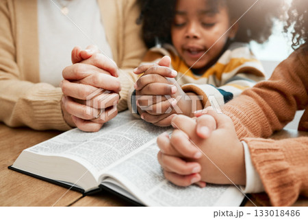 Bible, hands or mom praying with children siblings for prayer, support or hope together in Christianity. Kids education, family worship or woman studying, reading book or learning God in religion Bible, hands or mom praying with children siblings for prayer, support or hope together in Christianity. Kids education, family worship or woman studying, reading book or learning God in religion 133018486