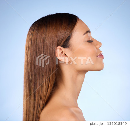 Skincare, cosmetics and profile of woman in studio with skin promo on blue background. Makeup, facial and face of beauty model from Brazil for dermatology or haircare promotion and mockup. 133018549