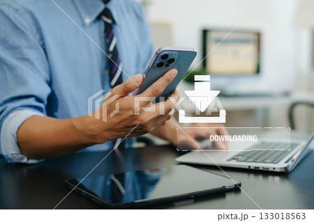 Man hands using a computer to Download processing data concept. Downloading data from cloud storage. 133018563