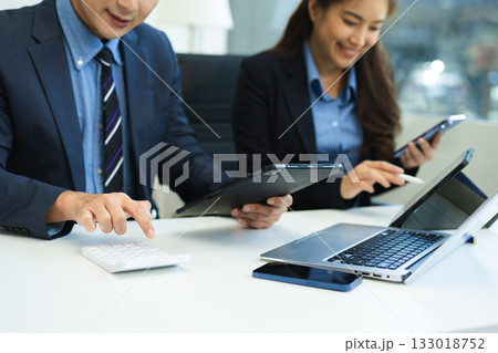 Business team meeting. professional investor working new start up project. Finance task. with smart phone and laptop and digital tablet Business team meeting. professional investor working new start up project. Finance task. with smart phone and laptop and digital tablet 133018752