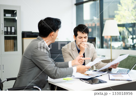 Frustrated manager scolds employee in office over financial error. Concept of workplace stress, reporting issues, conflict 133018956