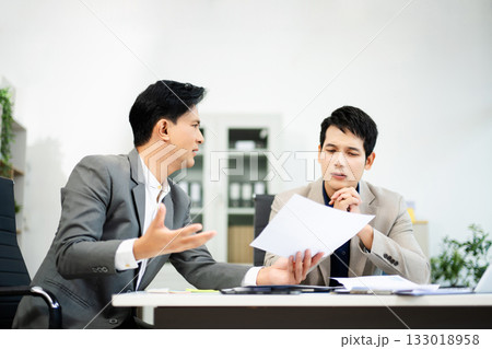 Frustrated manager scolds employee in office over financial error. Concept of workplace stress, reporting issues, conflict 133018958