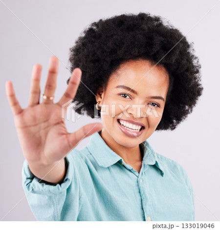 Happy, smile and hand with portrait of black woman in studio for confidence, positive and relax. Happiness, stretching and palm with female on gray background for cheerful, carefree and friendly Happy, smile and hand with portrait of black woman in studio for confidence, positive and relax. Happiness, stretching and palm with female on gray background for cheerful, carefree and friendly 133019046