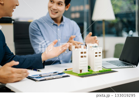 Signing a contract. Client and broker agent, lease agreement, successful deal and Young business sitting at the desk Signing a contract. Client and broker agent, lease agreement, successful deal and Young business sitting at the desk 133019295