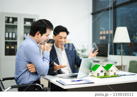 Professional team collaboration in modern office, discussing real estate model and signing contract, concept of startup Professional team collaboration in modern office, discussing real estate model and signing contract, concept of startup 133019311