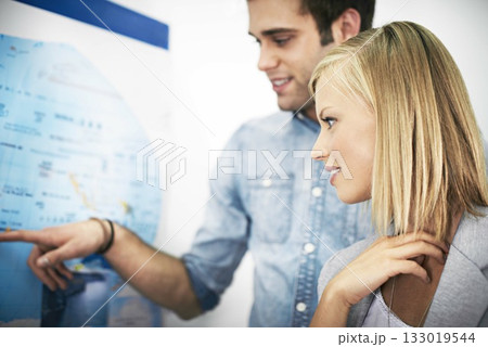 Travel agency teamwork, map and happy business people, agent or partner pointing at world tour location. Tourism industry advice, workplace collaboration and team working on route journey destination 133019544