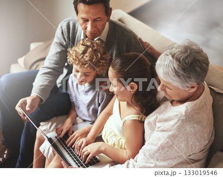 Grandparents, laptop or fun kids learning how to type or playing online game in family home together. Education, child development or children siblings on computer with grandmother or grandfather 133019546