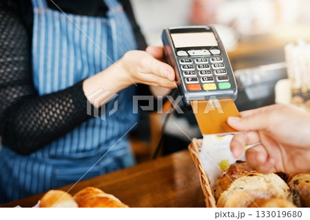 Credit card payment, bakery and hands with a machine at a restaurant for a service or food. Cafe, pay and a customer paying or buying a product at a coffee shop with a transaction from a worker 133019680