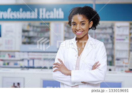 Happy, arms crossed and portrait of black woman in pharmacy for medical, pills and retail. Medicine. healthcare and trust with pharmacist in drug store for product, wellness and expert advice 133019691