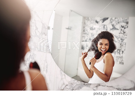 Woman, beauty and singing in mirror at apartment for haircare, fun, and preparing for the day. Female glow, happy and skincare with singer in the mirror for morning routine with hair and happiness. Woman, beauty and singing in mirror at apartment for haircare, fun, and preparing for the day. Female glow, happy and skincare with singer in the mirror for morning routine with hair and happiness. 133019729