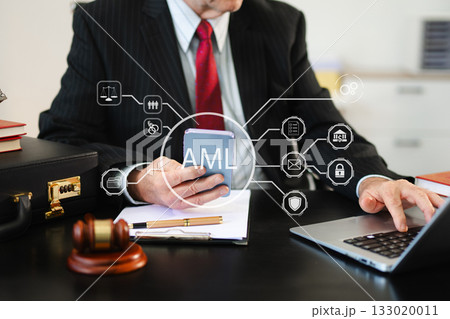 AML Anti Money Laundering Financial Bank Business Concept. judge in a courtroom using laptop and tablet 133020011