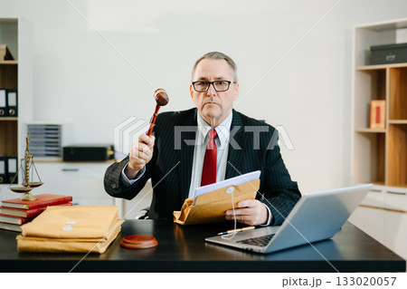 Professional male lawyers consulting on legal cases in a modern office. Perfect for law, business, justice, legal advice 133020057