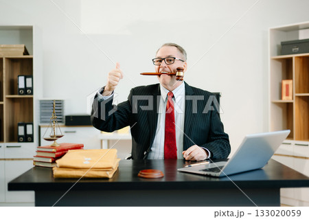 Male judge in courtroom, lawyer working in office. Perfect for business, legal advice, corporate law, and professional consulting themes. Male judge in courtroom, lawyer working in office. Perfect for business, legal advice, corporate law, and professional consulting themes. 133020059