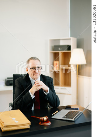 Professional male lawyers consulting on legal cases in a modern office. Perfect for law, business, justice, legal advice 133020061