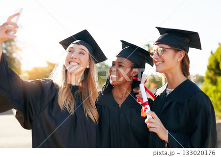 Women, friends and graduation selfie for college or university students together with a smile. Happy people outdoor to celebrate education achievement, success or future at event for school graduates Women, friends and graduation selfie for college or university students together with a smile. Happy people outdoor to celebrate education achievement, success or future at event for school graduates 133020176