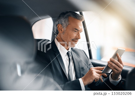 Tablet, business man and car for travel, journey or drive while reading email. Professional male person with tech for communication and internet connection for work with luxury transportation or taxi 133020206