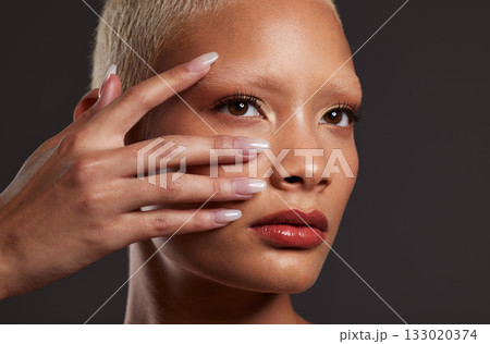 Makeup, beauty and face of woman with manicure in studio for skincare products, cosmetics and wellness. Salon aesthetic, cosmetology and girl model for nails, self love and luxury on dark background Makeup, beauty and face of woman with manicure in studio for skincare products, cosmetics and wellness. Salon aesthetic, cosmetology and girl model for nails, self love and luxury on dark background 133020374