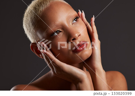 Beauty, makeup and cosmetics, black woman looking up in dark studio with platinum hair isolated on grey background. Art aesthetic, cosmetics and beautiful African model in skin glow and luxury facial Beauty, makeup and cosmetics, black woman looking up in dark studio with platinum hair isolated on grey background. Art aesthetic, cosmetics and beautiful African model in skin glow and luxury facial 133020399