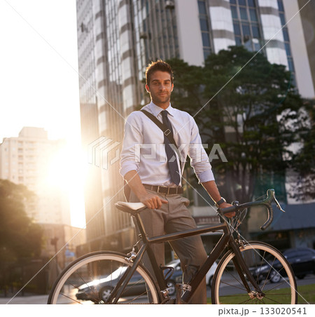Cycling, portrait and business man in city for commute, carbon neutral and transportation. Sustainable, professional and travel with male employee walking with bike in urban town for journey and trip 133020541