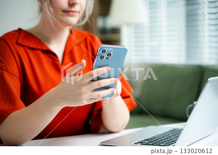 Businesswoman hand working digital marketing media in virtual screen with mobile phone and modern compute with VR icon diagram at office 133020612