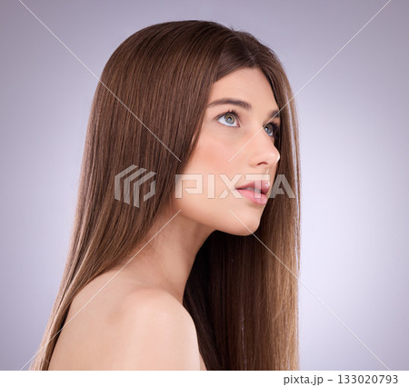 Face, beauty and hair care of a woman in studio isolated on a gray background. Makeup cosmetics, thinking and young female model with salon treatment for healthy keratin, balayage or hairstyle growth 133020793