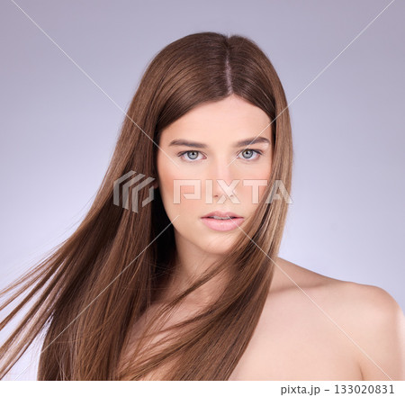 Portrait, hair and breeze with a model woman in studio on a gray background for haircare or keratin treatment. Shampoo, salon and beauty with an attractive young female posing in a wind on a wall Portrait, hair and breeze with a model woman in studio on a gray background for haircare or keratin treatment. Shampoo, salon and beauty with an attractive young female posing in a wind on a wall 133020831