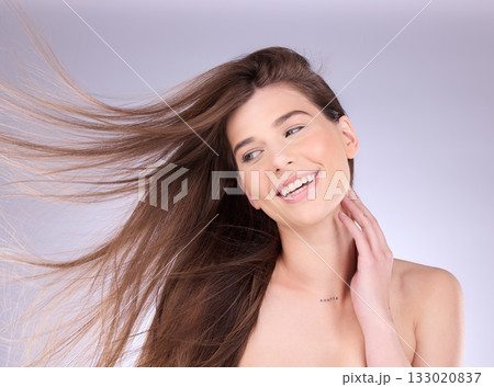 Beauty, hair and breeze with a model woman in studio on a gray background for haircare or keratin treatment. Shampoo, salon and natural with an attractive young female posing in a wind on a wall Beauty, hair and breeze with a model woman in studio on a gray background for haircare or keratin treatment. Shampoo, salon and natural with an attractive young female posing in a wind on a wall 133020837