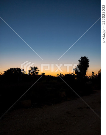 Experience the serene beauty of a Sunset Landscape with captivating silhouettes Experience the serene beauty of a Sunset Landscape with captivating silhouettes 133022032