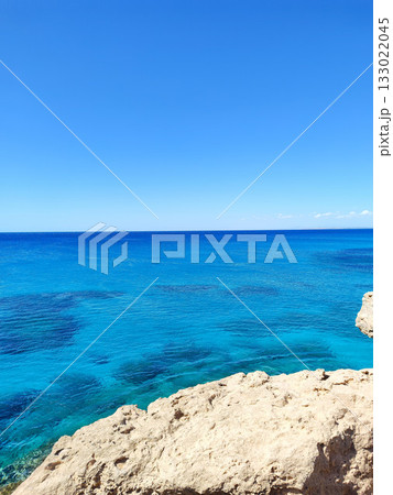 A Serene Ocean View Offering Clear Blue Waters and a Beautiful Rocky Shoreline to Enjoy 133022045