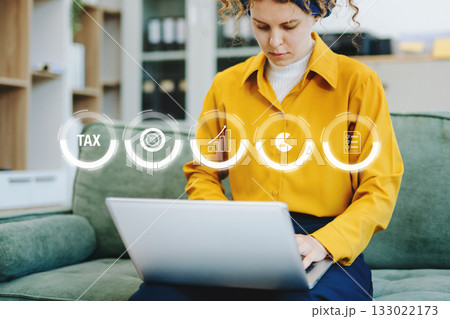 Business using a computer to complete Individual income tax return form online for tax payment.Tax and Vat concept. Business using a computer to complete Individual income tax return form online for tax payment.Tax and Vat concept. 133022173