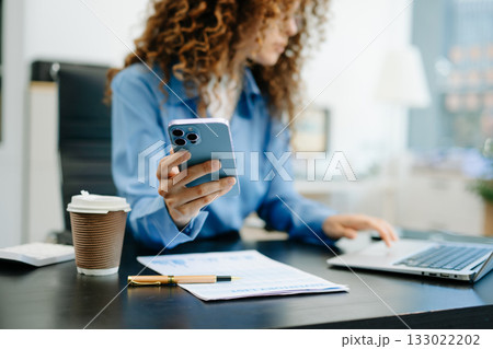 woman s hands typing on smartphone, tablet and laptop keyboard computer, typing, online in office woman s hands typing on smartphone, tablet and laptop keyboard computer, typing, online in office 133022202