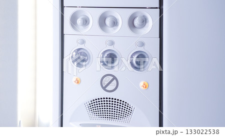 Modern white air conditioning unit with control panel and indicator lights, showcasing sleek design and functionality for indoor climate control Modern white air conditioning unit with control panel and indicator lights, showcasing sleek design and functionality for indoor climate control 133022538