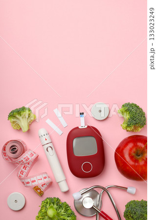 Tools for diabetes management and fresh foods displayed 133023249