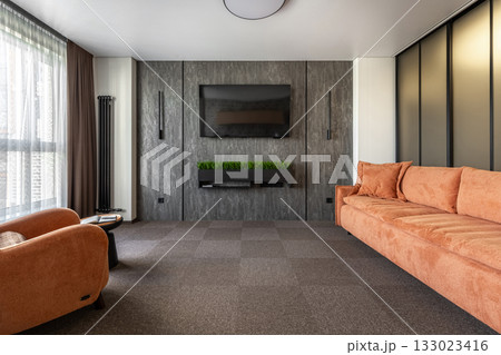 Contemporary Living Room with Orange Sofa and Textured TV Wall Contemporary Living Room with Orange Sofa and Textured TV Wall 133023416