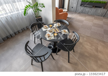 Cozy Tea Table Setup in Modern Apartment Interior Cozy Tea Table Setup in Modern Apartment Interior 133023417