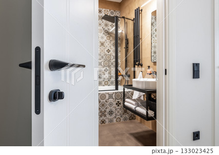 Modern Bathroom Interior with Open White Door 133023425