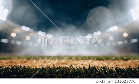 Experience the thrill of the game with this captivating sports field background under stadium lights at night Experience the thrill of the game with this captivating sports field background under stadium lights at night 133023776