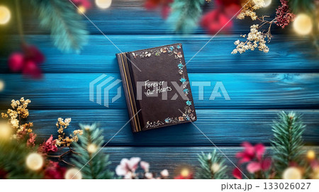Memories Book Decorated for Christmas on Blue Wooden Background 133026027